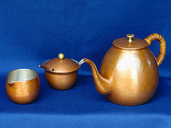 Hammered copper pot set in natural color