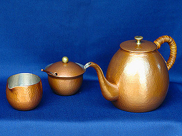 Hammered copper pot set in natural color
