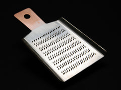 Tabletop battledore shaped ginger grater